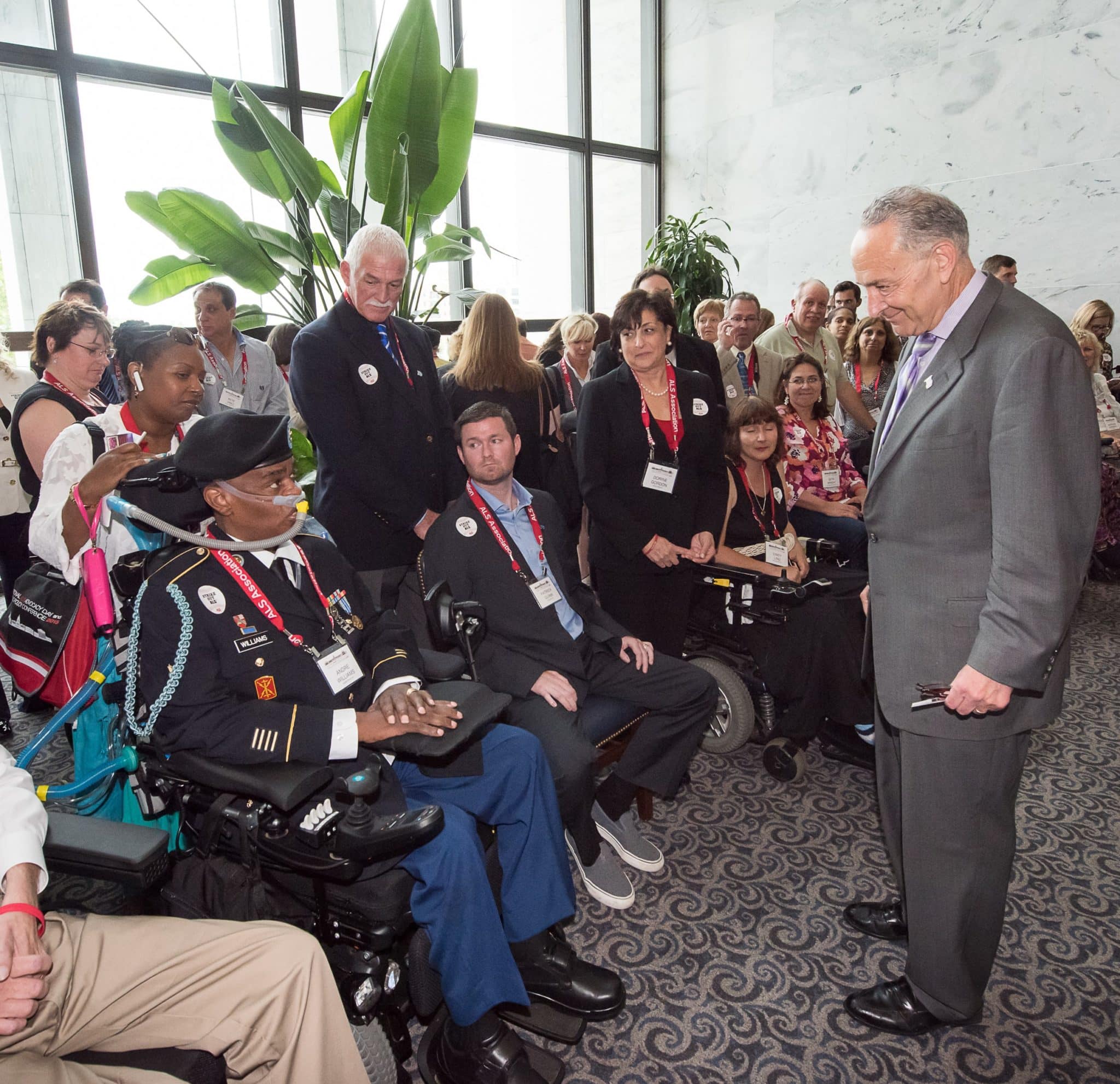Senator Schumer and veteran with ALS