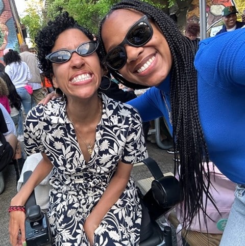 young person with ALS and her friend